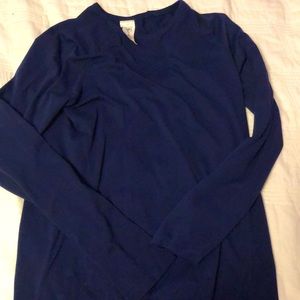 This is athleta girl shirt, that is long sleeve and is color dark blue.